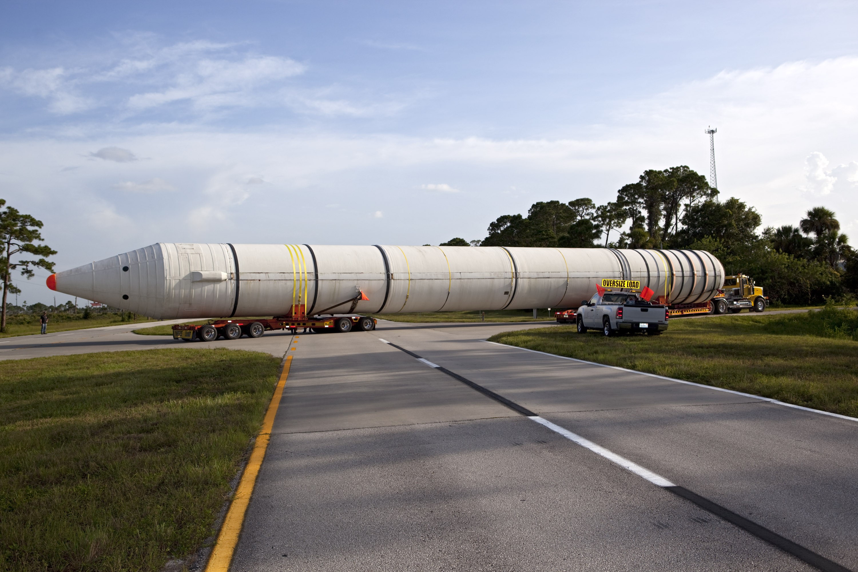 A space shuttle solid rocket booster is being transported by truck to California.