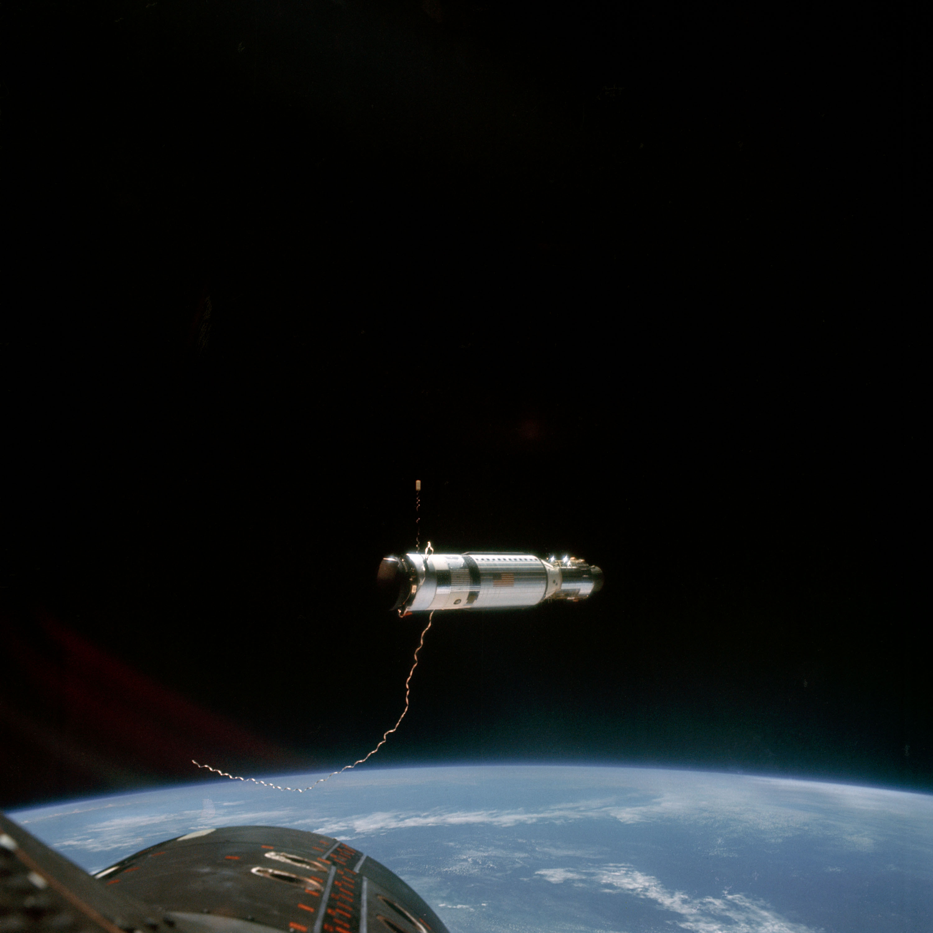 The Agena Target Docking Vehicle at a distance of approximately 80 feet from the Gemini-11 spacecraft.