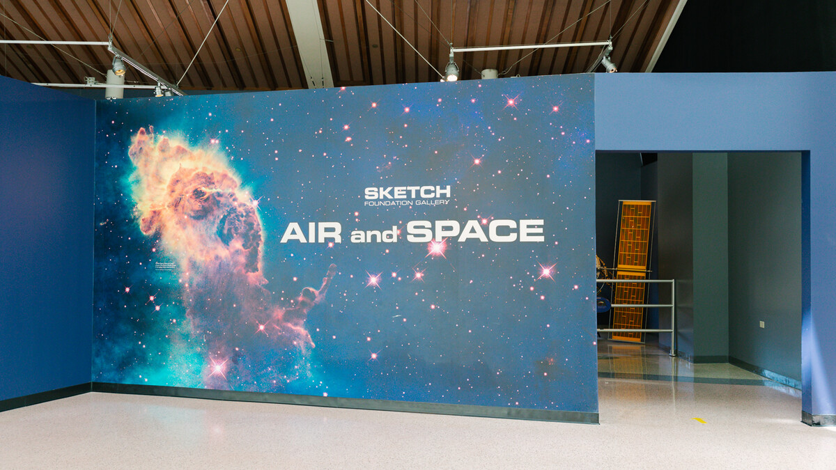 Blue wall featuring a large nebula photo reads "Sketch Foundation Gallery Air & Space"