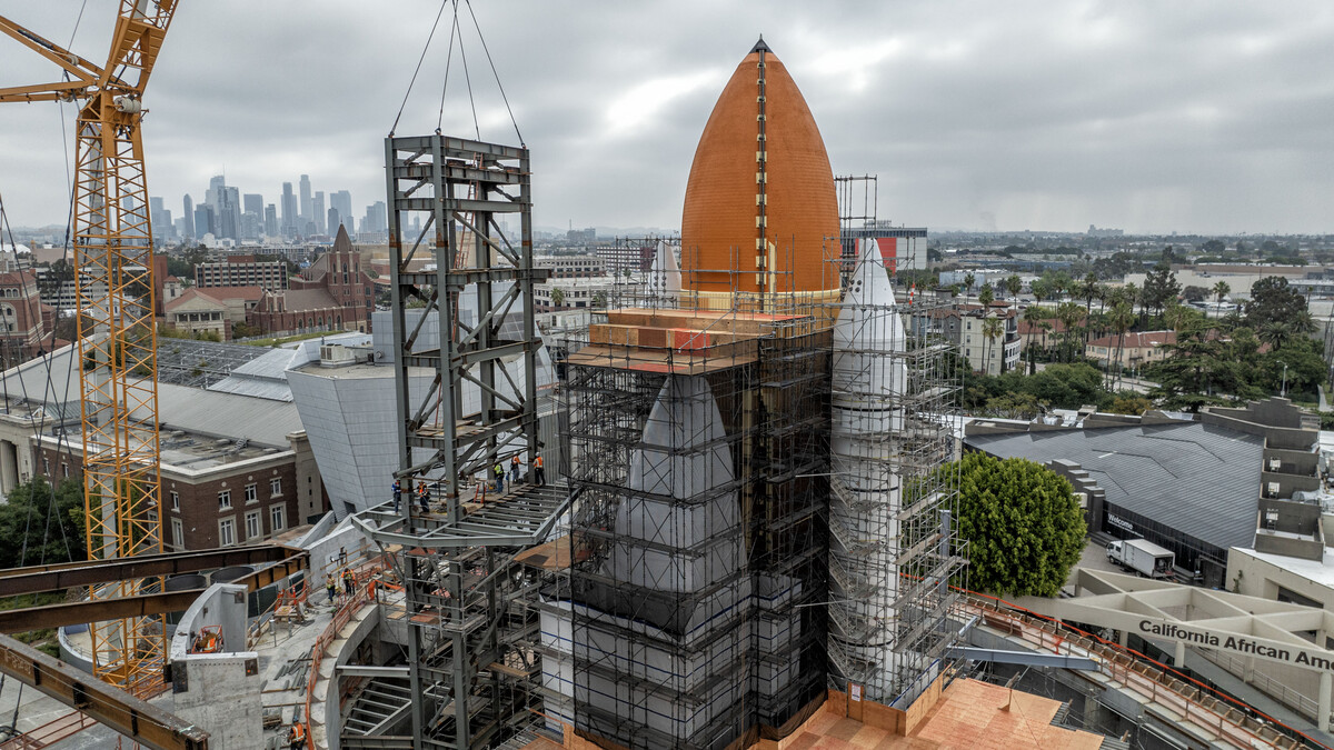 Gantry installed in Shuttle Gallery on construction site with Downtown LA in background