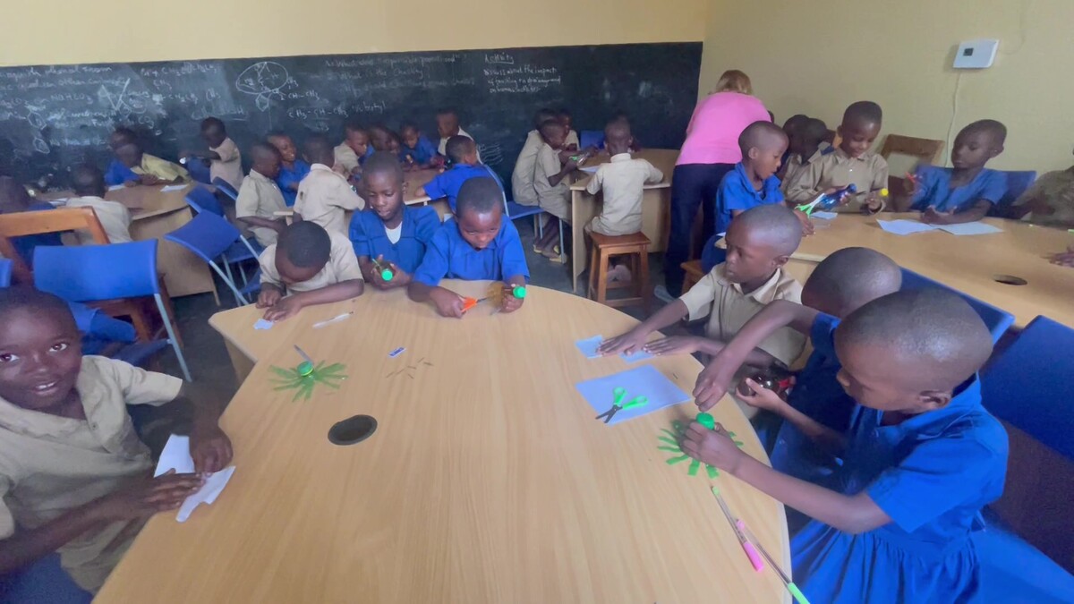 Students in a Rwanda classroom doing science activities