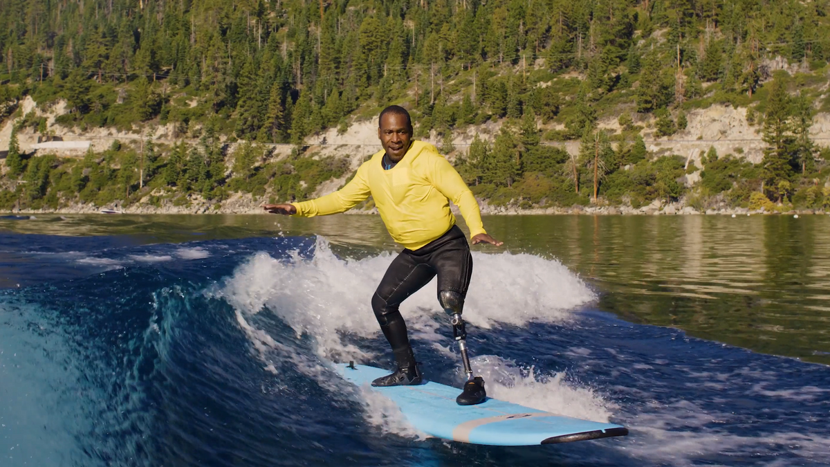 Superhuman Body 3D featured character Ty Duckett surfs while wearing a prosthetic leg.