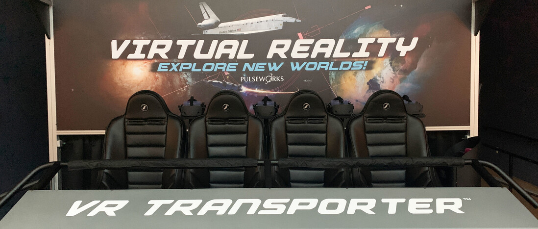 A virtual reality ride setup with four seats across