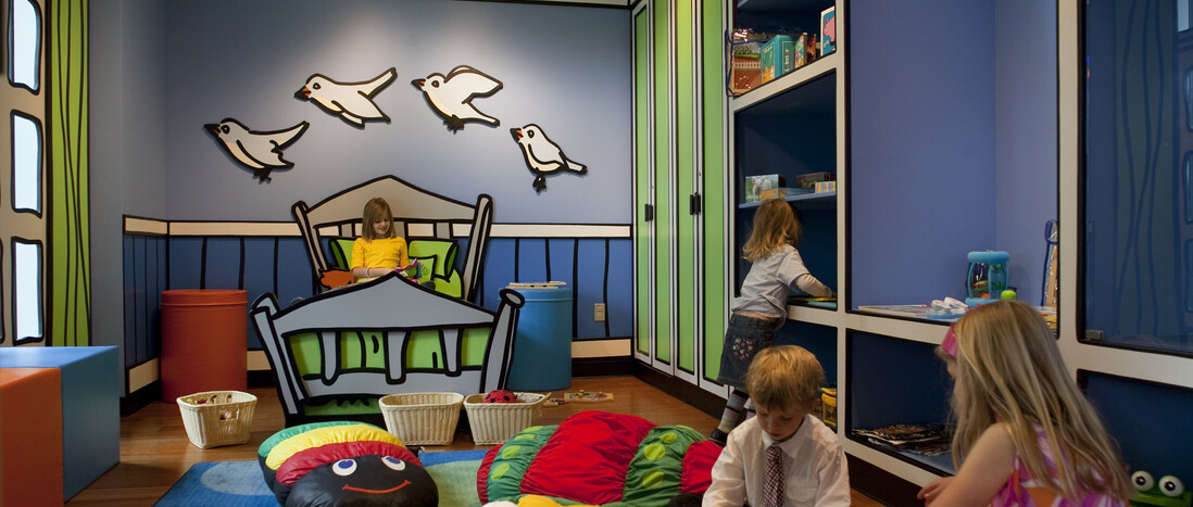 Kids playing inside Ecosystems Discovery Room bedroom