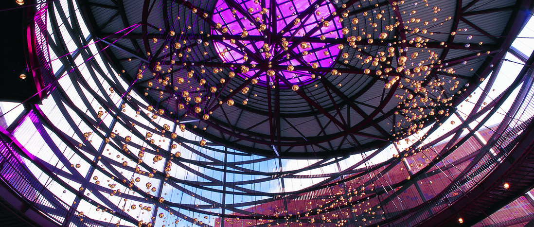 Looking up at the The Aerial, a hanging sculpture of 1,578 gold and palladium balls inside the Robert H. Lorsch Family Pavilion at the California Science Center.