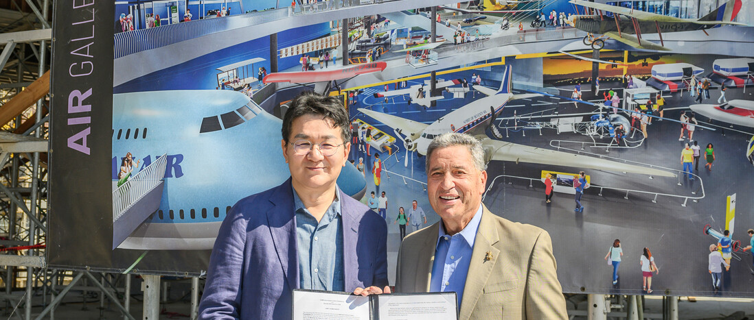 Korean Air's Chairman and CEO, Walter Cho, poses with the President and CEO of the California Science Center, Jeffrey Rudolph, at the site of the future Samuel Oschin Air and Space Center.