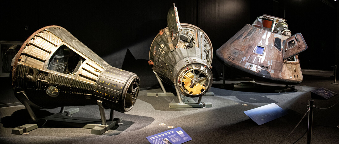 Photo shows L-R: Mercury-Redstone 2 Capsule*, Gemini 11 Capsule* and Apollo Soyuz Command Module* * All three capsules are on loan from the National Air and Space Museum, Smithsonian Institution. ** On loan from Lockheed Martin Corporation